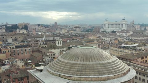 Aerial drone view of the iconic Pantheon basilica built as a temple for all the gods of ancient Rome and rebuilt by emperor Hadrian around 126 AD, Rome, Italy. Aerial shot with drone with-