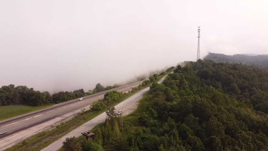 Vehicles Travelling At I-75 In The Mountains Of Tennessee On A Foggy Day - Rarity Mountain Road In Newcomb, Tennessee, USA. - aerial ascend