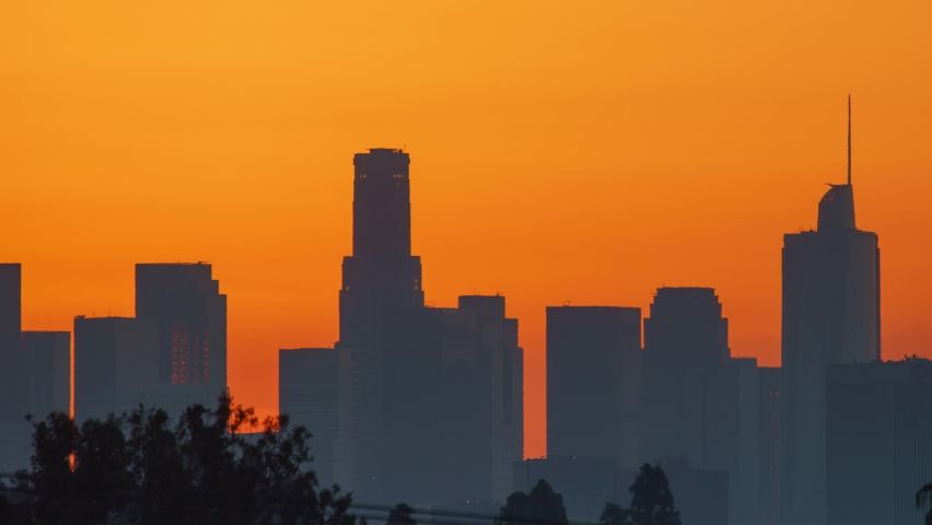 Downtown Los Angeles. Sunrise sun over city buildings silhouettes, zoom out. Timelapse, 4K UHD	
 | Shutterstock HD Video #1063431787