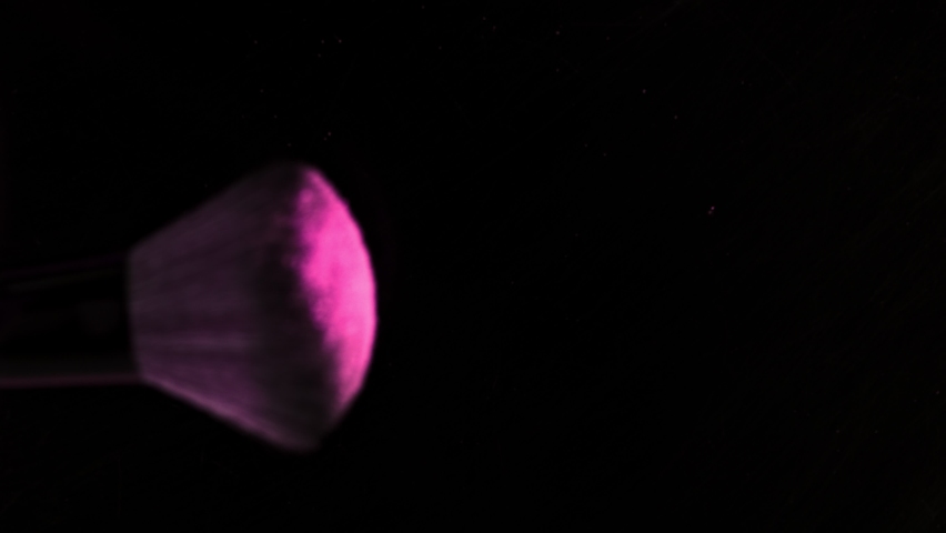 Super Slow Motion Shot of Makeup Brush and Pink Powder Falling on Black Table at 1000 fps. | Shutterstock HD Video #1063432645