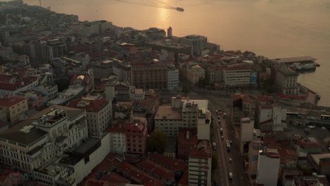 Early Morning Golden Light above Istanbul, Sunrise over the Bosphorus from an Aerial Tilt up perspective in September 2020