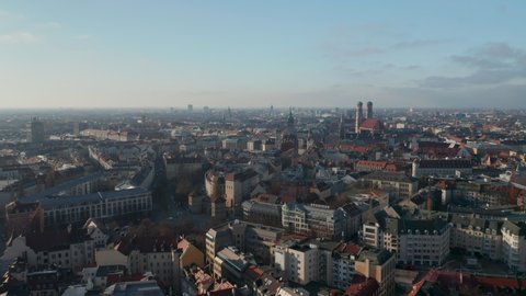 Beautiful City View over Munich, Germany with almost no traffic at Isa Tor, old city gate and Frauenkirche Cathedral in distance, Aerial View above Munich in Autumn