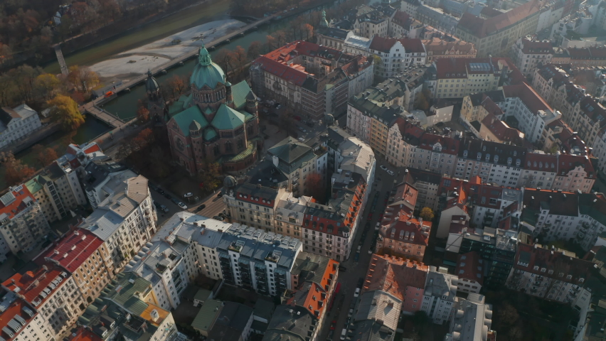 Tilt down Aerial Shot above typical Germany City Neighbourhood in Munich next to beautiful Cathedral and Isa River, Residential Streets, Aerial Birds Eye Overhead Top Down View 