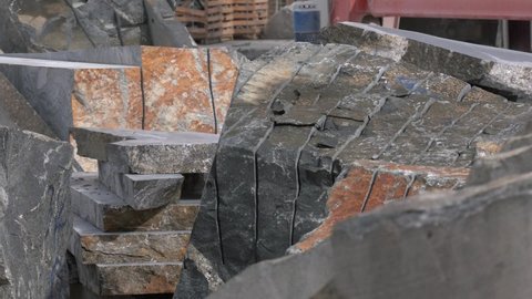 granite mining in marble quarry. Cracked granite stones.
