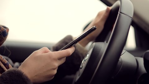 Checking Email Chats And Reading News. Driver Writing Message SMS In Vehicle On Social Network Chats On Cellphone. Texting And Driving Car On Social Media.Drive Texting On Smartphone While Driving Car
