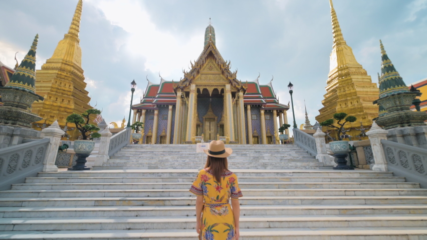 Asian woman visiting Wat Phra Kaew or Emerald buddha temple in Bangkok Thailand Royalty-Free Stock Footage #1063443562