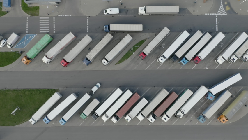 trucks in the parking lot, shot from the drone Royalty-Free Stock Footage #1063449475