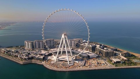 Bluewaters island and Ain Dubai ferris wheel on in Dubai, United Arab Emirates aerial footage. New leisure and residential area in Dubai marina area
