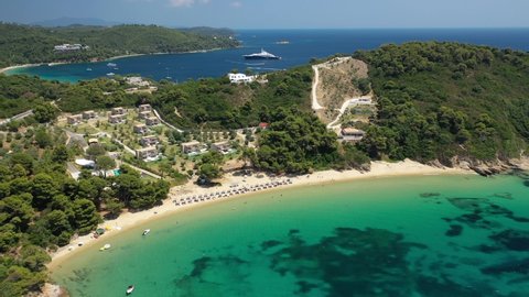 Aerial drone video of paradise beaches of Banana and small Banana covered with pine trees in beautiful island of Skiathos, Sporades, Greece