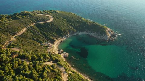 Aerial drone video of secluded emerald beach of Krifi or "hidden beach" in island of Skiathos, Sporades, Greece