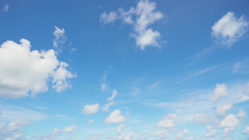 Time-lapse white clouds fast fly in the blue sky landscape. Amazing seascape summer sunny sky. Royalty-Free Stock Footage #1063474741