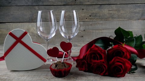 St. Valentine's Day. Red roses with a red ribbon on the table. Heart box. Present. Celebrate. Valentine's Day.  4K