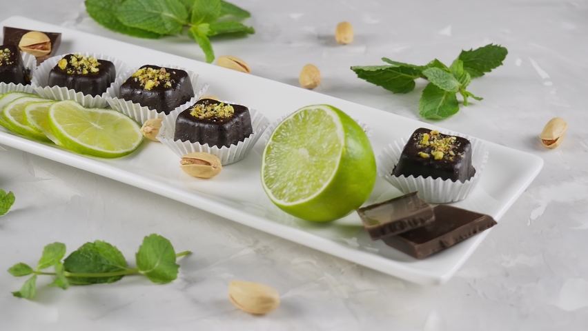 Pp sweets in chocolate. Healthy candies made from live fruits. Proper nutrition. Homemade sweets. Lime, mint. view from above