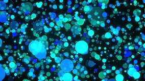 Multicolored confetti or glitter particles glitter in the light with depth of field. 4K video Festive bright animated circle screensaver.
