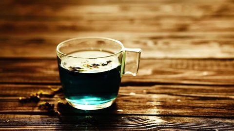 Blue tea on wooden background, butterfly pea tea