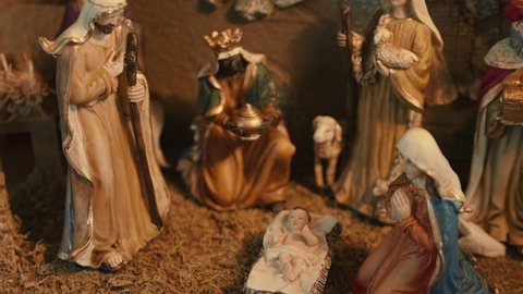 Christmas Nativity Scene showing figurines of baby Jesus, Mary, Joseph, the Wisemen and Shepherds. 