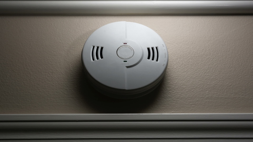 Smoke and fire trigger a home�s smoke alarm sending out a series of loud warning beeps. | Shutterstock HD Video #1063487773