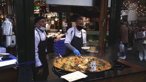 London, England, UK - November, 2020: Hot food, Seafood paella sold at Borough Market in London