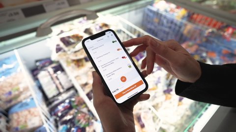 London, UK - November 14, 2020 Sainsburys supermarket, Smart shop mobile app looking through shop items