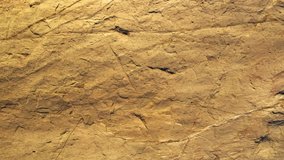 Old brown stone wall abstract texture. Nature pattern for decoration. Background video for design.