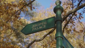 Signpost showing local places in Pavlovsk Park in autumn, St. Petersburg, Russia. High quality 4k footage