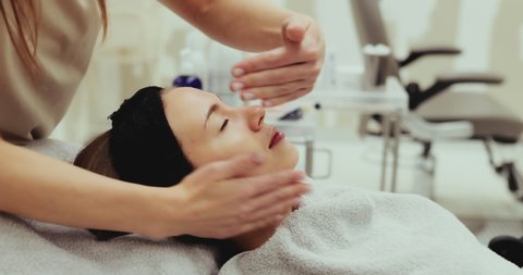 Woman receiving a facial massage. High quality 4k footage