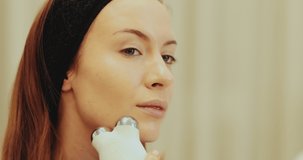 Facial skin care. Woman doing a facial massage. High quality 4k footage
