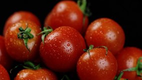 Cherry tomatoes close-up. Rotating red Cherry tomatoes as background video. Red Cherry Tomato Clockwise.