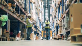 Warehouse worker on a forklift getting the load down - Powered by Shutterstock - Get 15% off with code: PIKWIZARD15