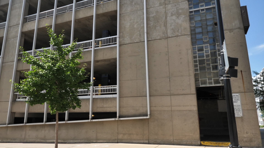 Driving by Modern Garage Building in Downtown Madison, Wisconsin USA. Passenger POV From Moving Vehicle
