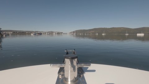 POV viewpoint from bow of powerboat as it cruises on Knysna Lagoon