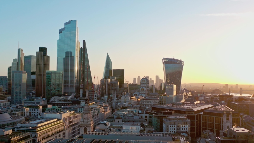 Aerial slider shot of Central London skyscraper buildings and canary wharf at sunrise Royalty-Free Stock Footage #1063510891