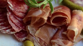 Meat snacks served on plate for wine appetizer