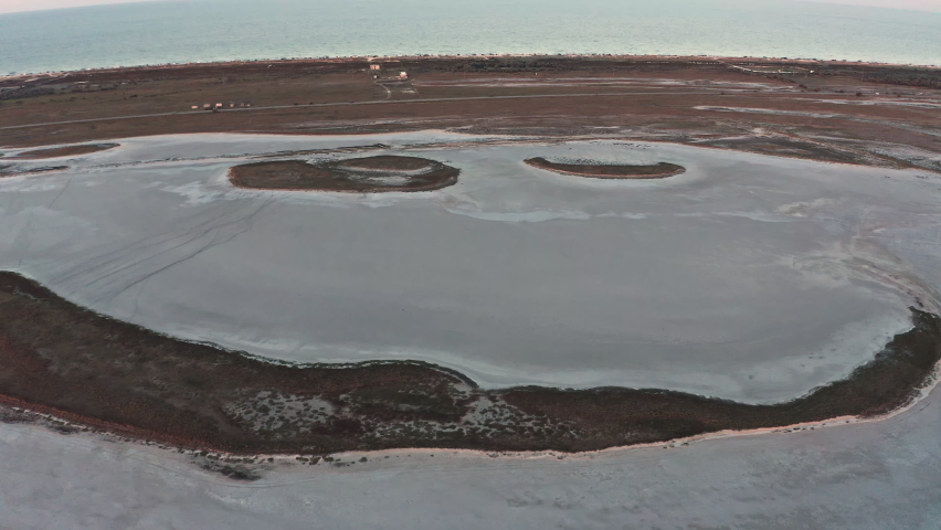 Sandy swamp near a beautiful lake, top view, drone camera