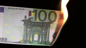 burning hundred euros on a black background. concept of combustion savings - Powered by Shutterstock - Get 15% off with code: PIKWIZARD15