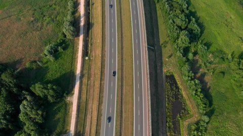 Aerial vertical shot. Cars driving by the road. Traffic on the highway. footage from drone.