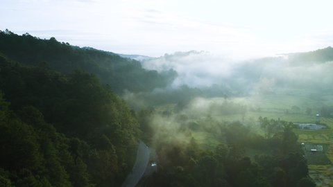 4K drone footage flying over mist mountain in morning in Chiang Mai, Thailand