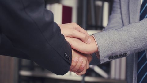Businessman making handshake hand supporting give empathy care, job interview in the meeting room at the office, congratulation connection concept.
