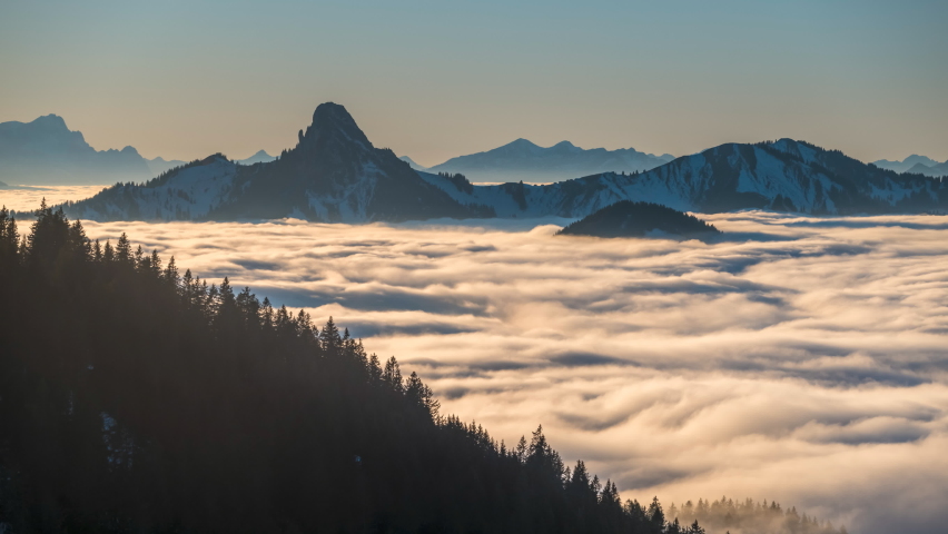 Cloud movements A sea of fog is formed from stratus. Above the clouds over. Flat surface.Alps mountain sunrise time lapse nature landscapes zugspitz, alpspitz mountain.