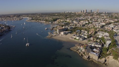Afternoon aerial view of the Newport Harbor, skyline and Corona del Mar beach of Newport Beach, California, USA.