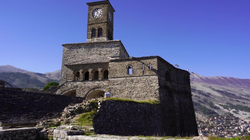 Beautiful clock tower of citadel with stone high walls in Gjirokaster, Albania