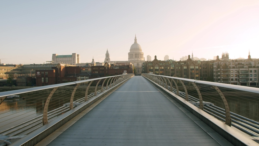 Lockdown in London, beautiful St Pauls Cathedral from deserted Millennium Bridge at golden hour, during the Coronavirus pandemic 2020.