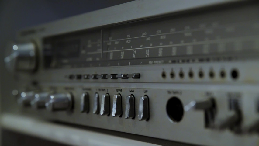 Close up of a vintage amplifier. Station search on a vintage radio. Station scan on a retro radio. Royalty-Free Stock Footage #1063555375