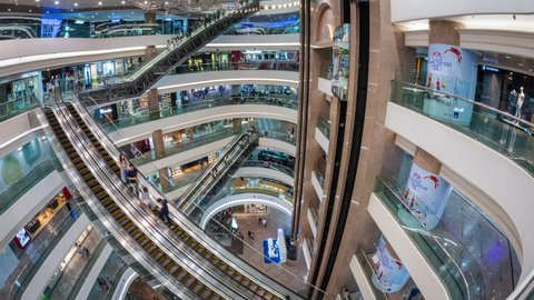 Hong Kong, China - June 17: Time lapse view of people shopping at Times Square Mall, a luxury shopping centre and office tower complex in Causeway Bay, Hong Kong, China. 