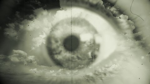 Opened Eyes Look Cloudy Sky Retro Style Black And White. Green eye wide opened overlaying lapsed clouds in blue sky. Double Exposure, vintage style