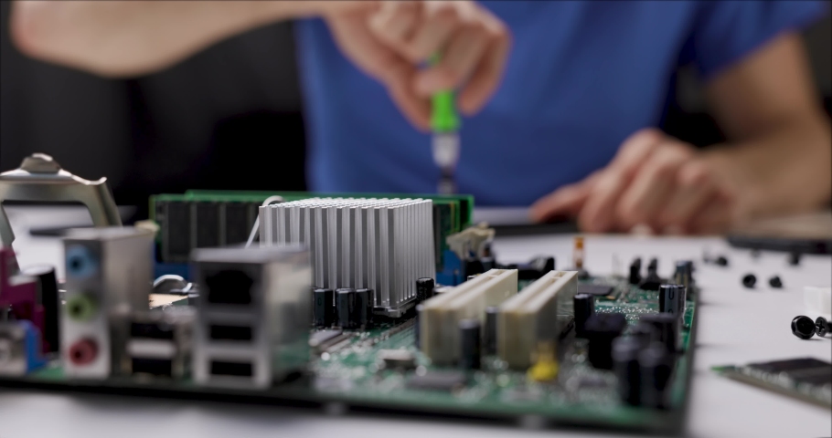 electronics repair and maintenance service. technician working with computer parts in office. slider shot Royalty-Free Stock Footage #1063575331