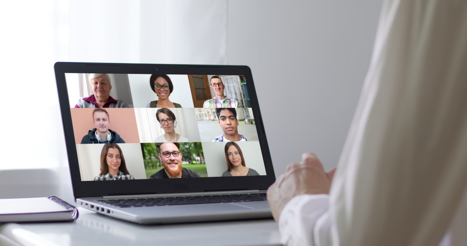 Online conference of colleagues through a laptop. Video call for training. Educational webinar chat between different people. Remote team communication together. | Shutterstock HD Video #1063581952