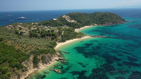 Aerial drone video of beautiful sandy beach of Agia Eleni next to famous banana beach, Skiathos island, Sporades, Greece