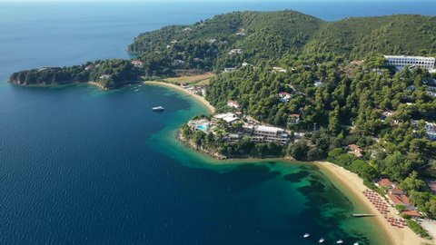 Aerial drone video of famous seaside area and bay of Kanapitsa with many beautiful secluded sandy beaches, Skiathos island, Sporades, Greece