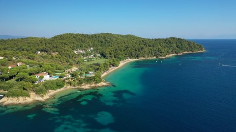 Aerial drone video of popular paradise turquoise beach of Vromolimnos with small swamp next to it, Skiathos island, Sporades, Greece
